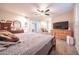 Main bedroom featuring neutral tones, carpet, and abundant natural light at 10326 W Kingswood Cir, Sun City, AZ 85351