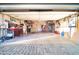 Spacious garage featuring ample storage, tool organization, and a clean, well-lit environment at 10326 W Kingswood Cir, Sun City, AZ 85351