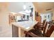 Kitchen island with granite countertop and seating at 10326 W Kingswood Cir, Sun City, AZ 85351