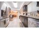 Updated kitchen with stainless steel appliances and tile flooring at 10326 W Kingswood Cir, Sun City, AZ 85351