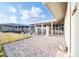 This outdoor patio space showcases stylish pavers and secure fencing for a private and inviting area at 10326 W Kingswood Cir, Sun City, AZ 85351