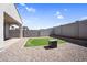 The private backyard includes desert landscaping, artificial turf, and hardscape at 11341 E Unger Ave, Mesa, AZ 85212