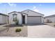 Beautiful single-story home with desert landscaping and a brick driveway at 11341 E Unger Ave, Mesa, AZ 85212