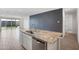 Open kitchen island that is part of an open floor plan and is well equipped at 11341 E Unger Ave, Mesa, AZ 85212