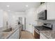 Bright kitchen with granite countertops, modern appliances, and tile flooring at 11341 E Unger Ave, Mesa, AZ 85212