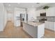 Modern kitchen with stainless steel appliances and a large granite island at 11341 E Unger Ave, Mesa, AZ 85212