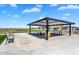 A covered picnic area provides shade and seating for residents at 11341 E Unger Ave, Mesa, AZ 85212