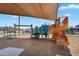 Community playground includes various play structures and safety surfacing at 11341 E Unger Ave, Mesa, AZ 85212