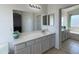 Spacious bathroom with dual vanities, large mirror, and separate soaking tub at 1137 W 21St Ave, Apache Junction, AZ 85120