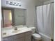 Bright bathroom featuring a large vanity, sink, toilet and shower at 1137 W 21St Ave, Apache Junction, AZ 85120