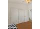 Bright bedroom features a ceiling fan and closet with sliding doors at 1137 W 21St Ave, Apache Junction, AZ 85120