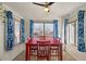 Bright dining room with large windows and blue curtains, perfect for Gathering meals at 1137 W 21St Ave, Apache Junction, AZ 85120
