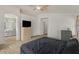 Main bedroom boasts a ceiling fan, attached ensuite bathroom, and closet at 1137 W 21St Ave, Apache Junction, AZ 85120