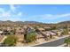 Charming neighborhood featuring tile roofs, desert landscaping and beautiful mountain views at 11413 S Coolwater Dr, Goodyear, AZ 85338
