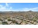 Elevated view captures the community nestled within a picturesque desert landscape, showcasing a mix of residences at 11413 S Coolwater Dr, Goodyear, AZ 85338