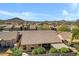 Private backyard featuring mature landscaping and a covered patio, perfect for relaxing or entertaining in the Arizona sunshine at 11413 S Coolwater Dr, Goodyear, AZ 85338