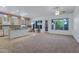 Bright kitchen with an island, tile floors, ample cabinet space and natural light at 11413 S Coolwater Dr, Goodyear, AZ 85338