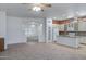 Open-concept kitchen featuring granite countertops, an island, and stainless steel appliances at 11413 S Coolwater Dr, Goodyear, AZ 85338