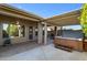 Outdoor patio with covered area, spa, and ceiling fan at 11413 S Coolwater Dr, Goodyear, AZ 85338