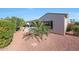 Cozy backyard patio with red rock landscaping, offering a private and relaxing outdoor living space at 12950 W Quinto Dr, Sun City West, AZ 85375