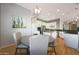 Cozy dining area with a round table, pendant lighting, and a view of the kitchen and its features at 12950 W Quinto Dr, Sun City West, AZ 85375