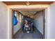 Well-organized garage with an open door, featuring storage and a golf cart at 12950 W Quinto Dr, Sun City West, AZ 85375