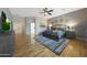 Spacious primary bedroom with hardwood floors and ensuite bathroom access at 12950 W Quinto Dr, Sun City West, AZ 85375