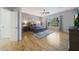 Large primary bedroom with hardwood floors, ceiling fan, and natural light at 12950 W Quinto Dr, Sun City West, AZ 85375