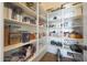 Spacious pantry with ample shelving and organization at 12950 W Quinto Dr, Sun City West, AZ 85375