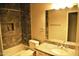 Nicely designed bathroom featuring a shower, tiled walls, and granite countertops at 1490 W Laurel Ave, Gilbert, AZ 85233