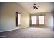Open bedroom with a ceiling fan and large windows bringing in plenty of light at 1490 W Laurel Ave, Gilbert, AZ 85233