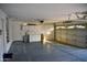 Spacious two-car garage with ample storage cabinets and work space at 1490 W Laurel Ave, Gilbert, AZ 85233