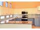 Well-equipped kitchen featuring granite countertops, stainless steel appliances, and ample cabinet space at 1490 W Laurel Ave, Gilbert, AZ 85233