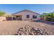 Backyard featuring desert landscaping, covered patio, and view of house at 1642 E Cardinal Dr, Casa Grande, AZ 85122