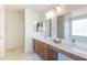 Bathroom boasts a double vanity, a large mirror, and a bright window at 1642 E Cardinal Dr, Casa Grande, AZ 85122