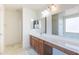Bathroom with large vanity, double mirrors, shower stall and a soaking tub at 1642 E Cardinal Dr, Casa Grande, AZ 85122