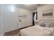 Bright bedroom featuring hardwood floors, white dresser, queen bed and decorative art at 1642 E Cardinal Dr, Casa Grande, AZ 85122