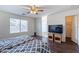 Bedroom boasts wood flooring and view of attached bathroom and a walk-in closet at 1642 E Cardinal Dr, Casa Grande, AZ 85122