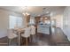 Eat-in kitchen features white chairs and a view into the kitchen with stainless appliances at 1642 E Cardinal Dr, Casa Grande, AZ 85122