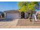 Charming single-story home featuring a well-maintained yard and a two-car garage at 1642 E Cardinal Dr, Casa Grande, AZ 85122