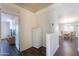 Hallway view leading to living area and additional room featuring a small refrigerator at 1642 E Cardinal Dr, Casa Grande, AZ 85122