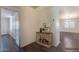 Hallway with console table offers a peek into living spaces beyond at 1642 E Cardinal Dr, Casa Grande, AZ 85122