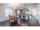 Spacious kitchen with an eat-in area, island, and wooden cabinetry at 1642 E Cardinal Dr, Casa Grande, AZ 85122