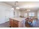Open concept kitchen and dining area with pendant lighting and hardwood floors at 1642 E Cardinal Dr, Casa Grande, AZ 85122