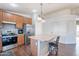Well-lit kitchen features updated appliances, stylish backsplash, and center island at 1642 E Cardinal Dr, Casa Grande, AZ 85122