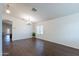 Open living space featuring wood-look floors and neutral paint at 1642 E Cardinal Dr, Casa Grande, AZ 85122