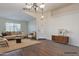 Spacious living room with ample natural light, neutral tones, and wood-style flooring at 1642 E Cardinal Dr, Casa Grande, AZ 85122