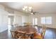 Spacious living area with a hardwood flooring, ceiling fan, and archway to another room at 1642 E Cardinal Dr, Casa Grande, AZ 85122