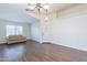 Bright living room featuring dark flooring and neutral colored walls at 1642 E Cardinal Dr, Casa Grande, AZ 85122