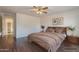 Main bedroom with neutral tones, wood flooring, and ample natural light at 1642 E Cardinal Dr, Casa Grande, AZ 85122